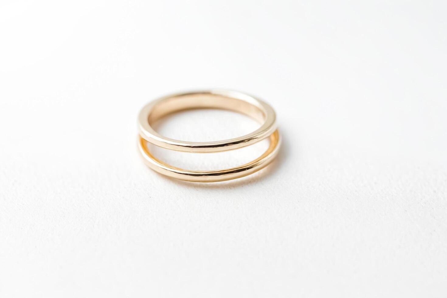 Gold ring on white background photo