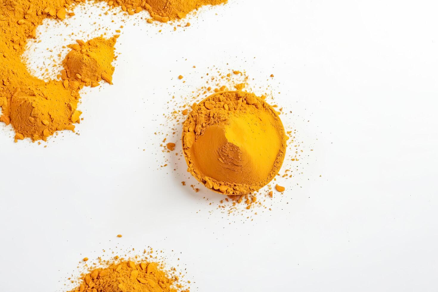 Turmeric Powder on White Background photo