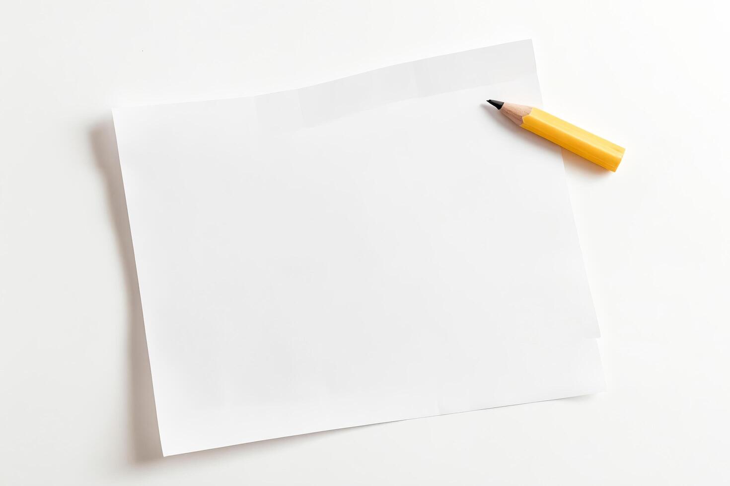 Yellow Pencil and Blank White Paper on White Background photo