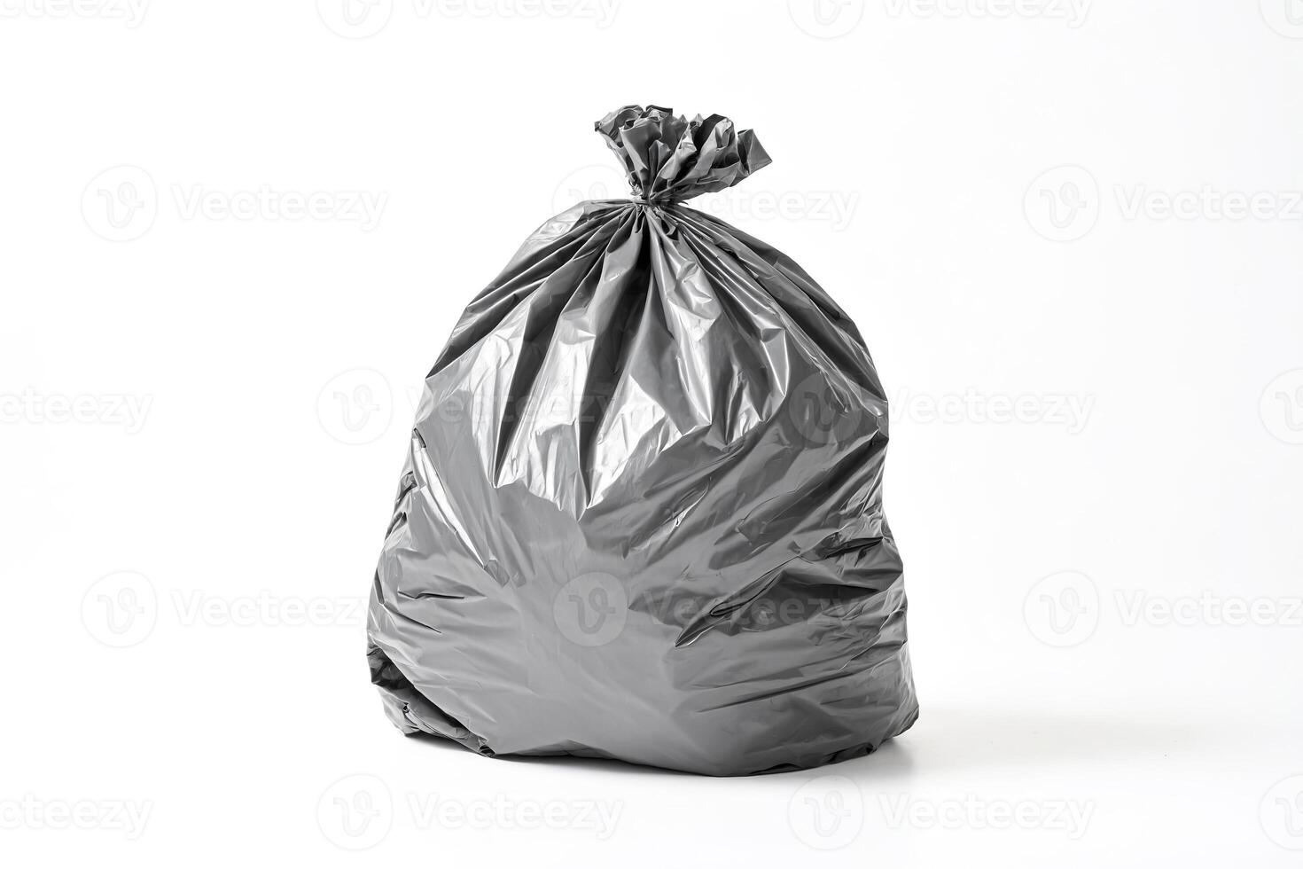 Black Plastic Trash Bag on White Background photo