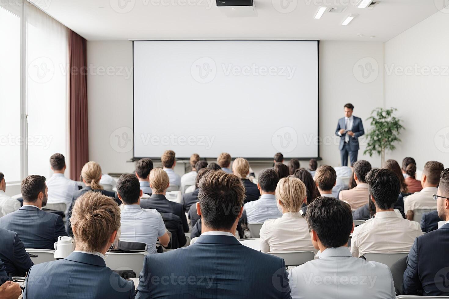 Attentive audience listening to a speaker during a business conference photo