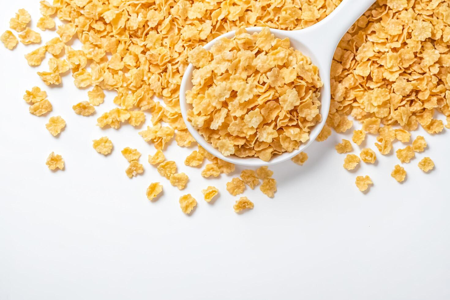 Cornflakes cereal in a white bowl on a white background photo