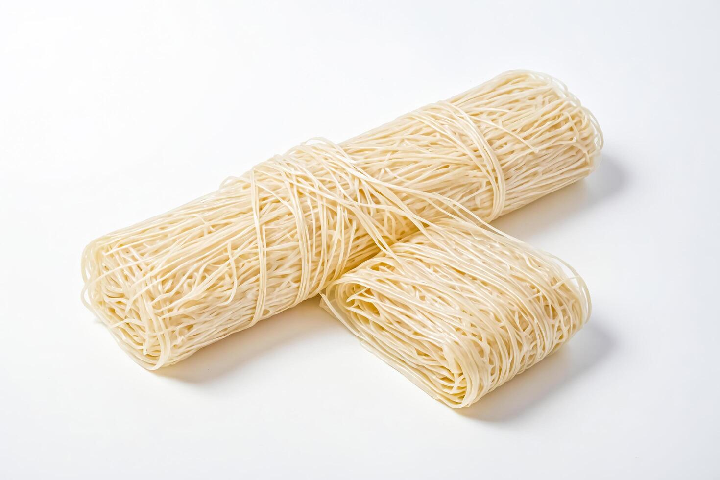 Uncooked Rice Noodles on White Background photo