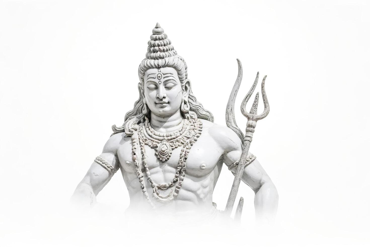 White Statue of Shiva with Trident on a White Background photo