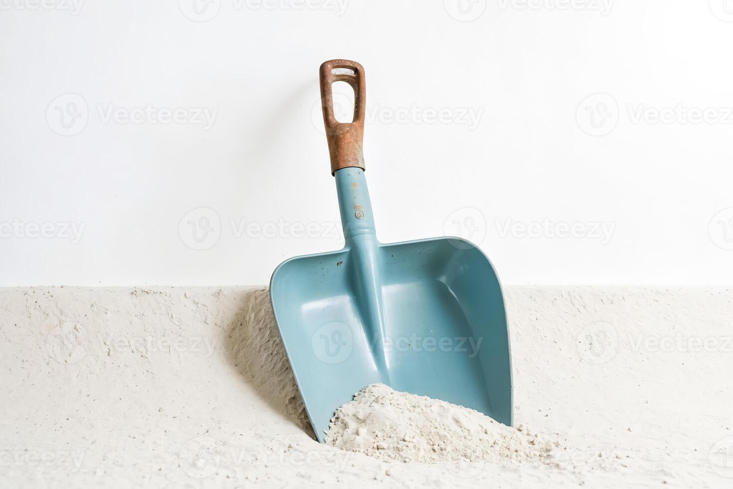 Blue Shovel in White Sand photo