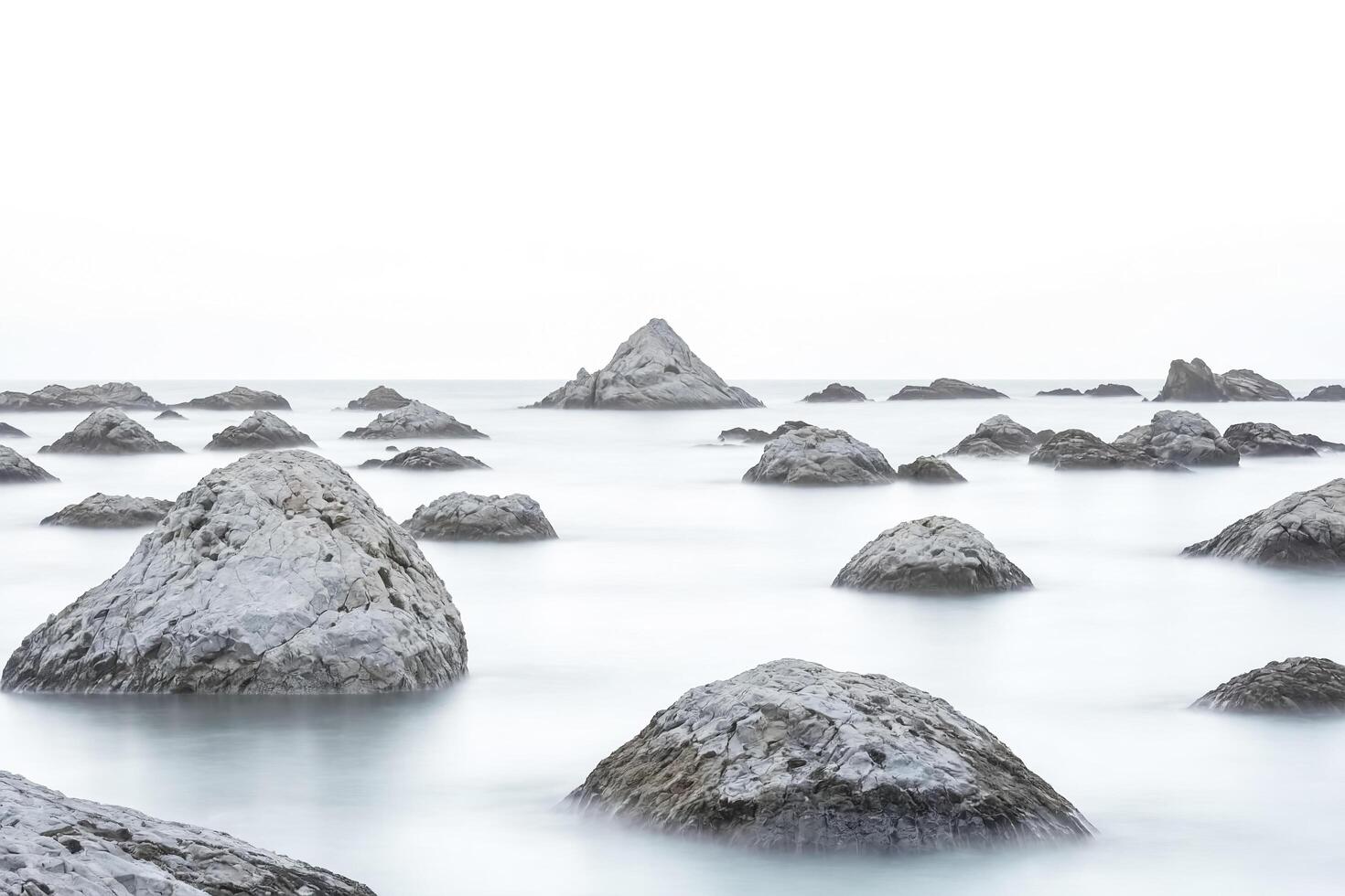 Blurry Rocks in the Ocean photo