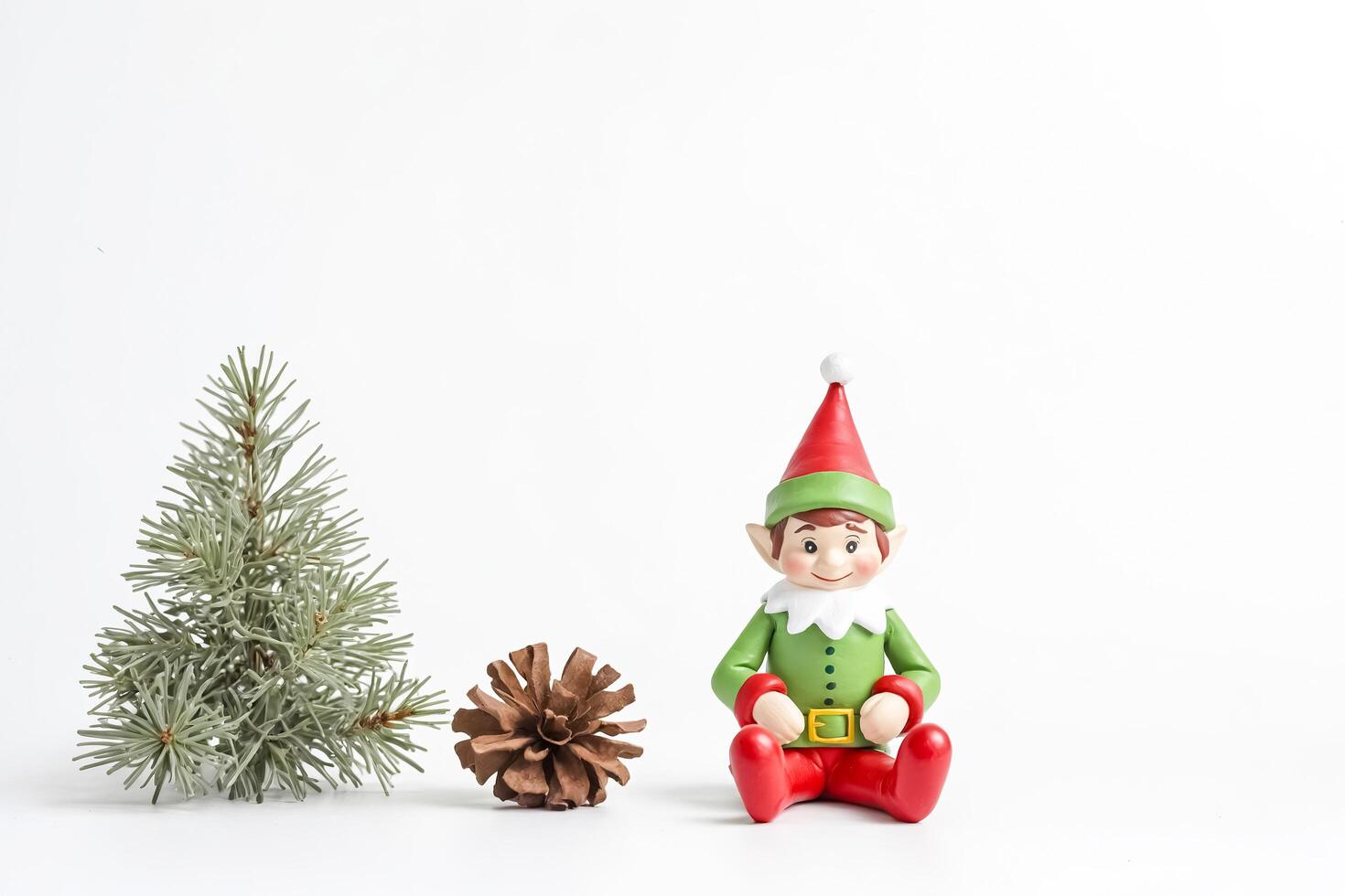 Festive Christmas Elf Figurine with Pine Branch and Pine Cone photo