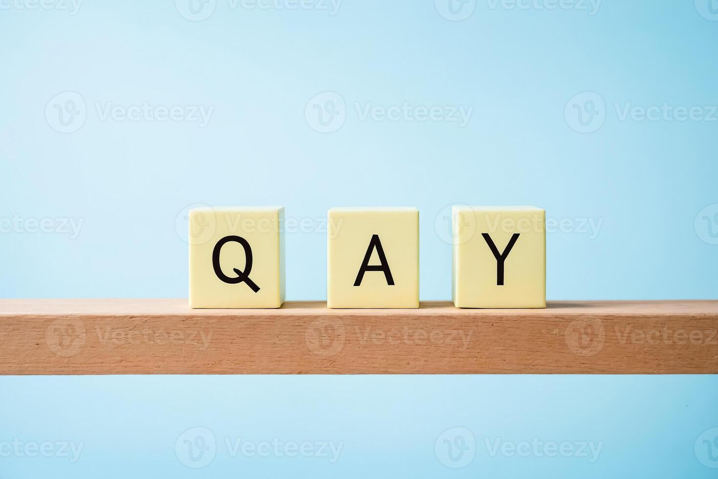 QA Blocks on Wooden Surface photo