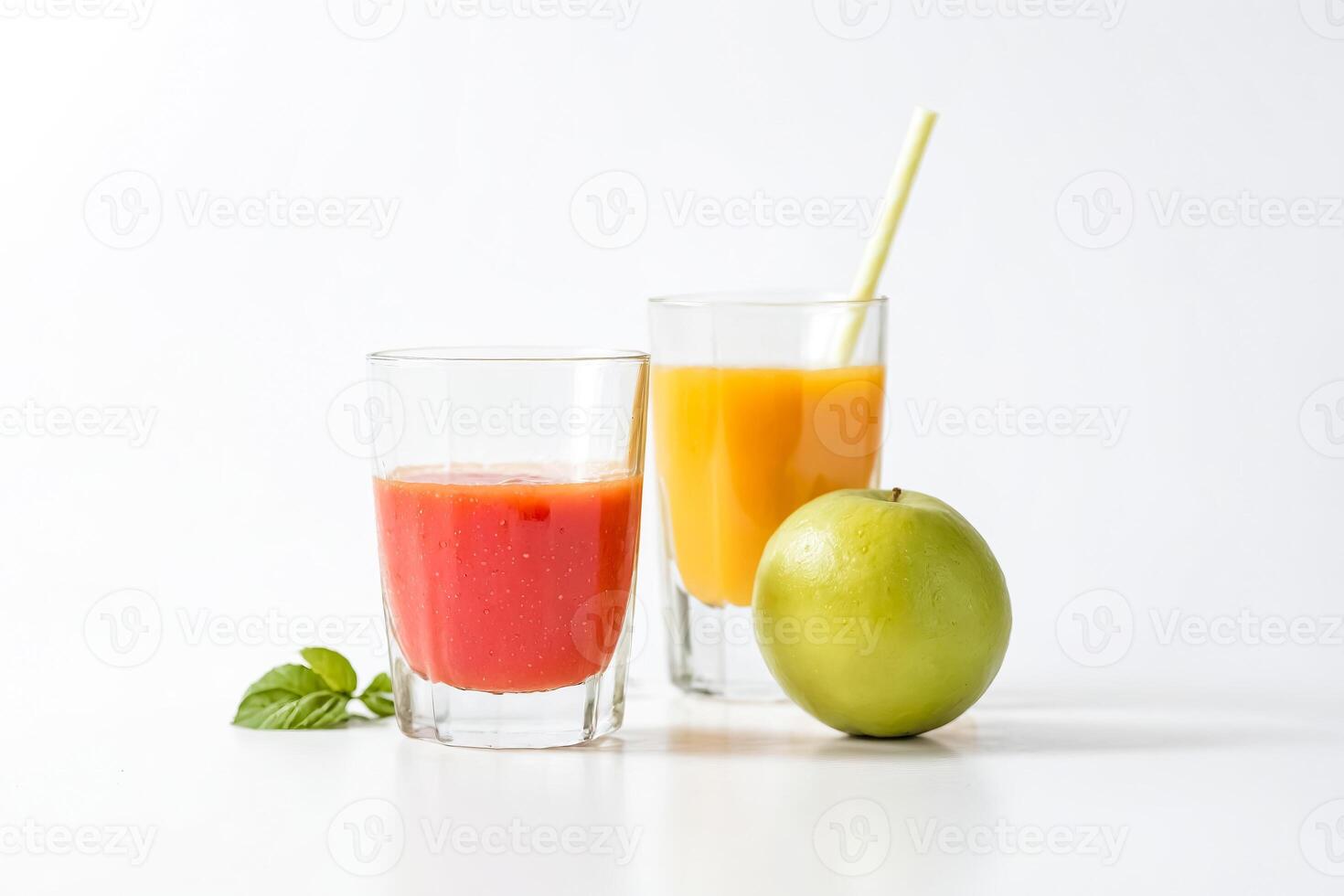 Glass of Tomato Juice with a Green Apple and Orange Juice in the Background photo