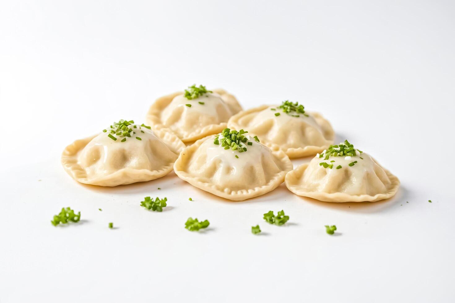 Close-up of Four Ravioli with Creamy Sauce and Chives photo