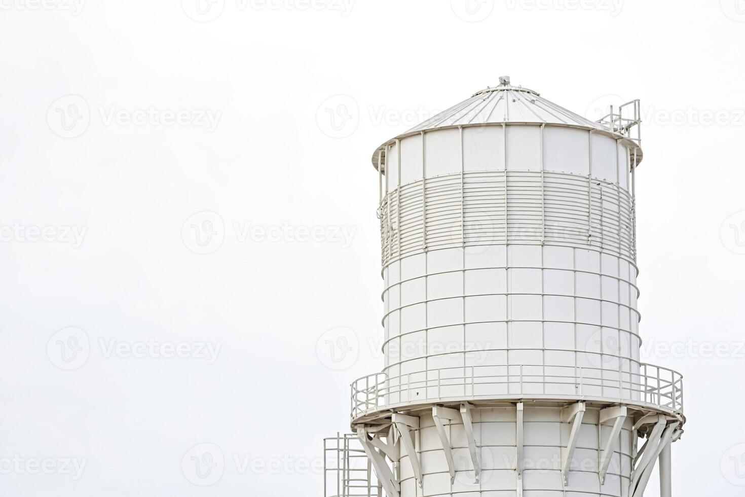 White Water Tower Against Blue Sky photo