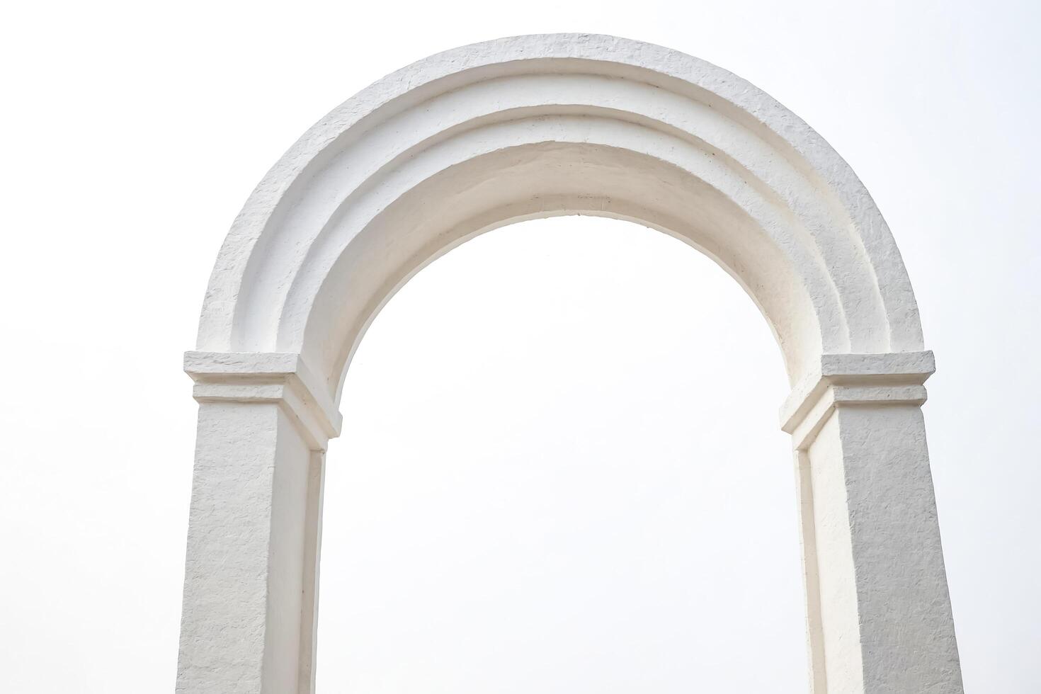 White Archway Against a Cloudy Sky photo