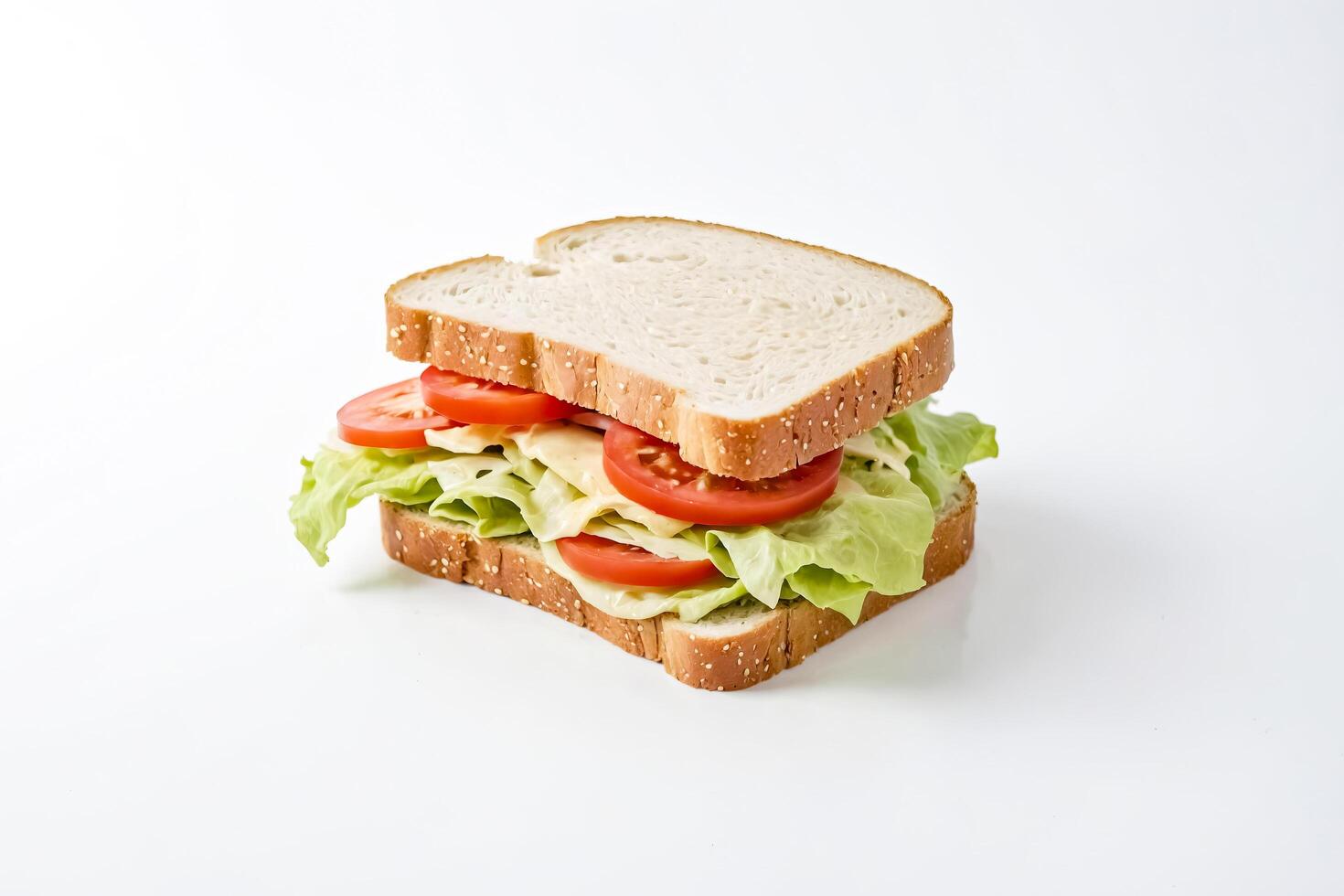 Close-up of a sandwich with tomato and lettuce on a white background photo
