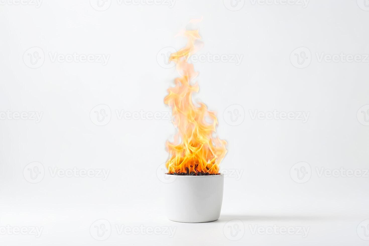 Fire burning in a white pot on a white background photo
