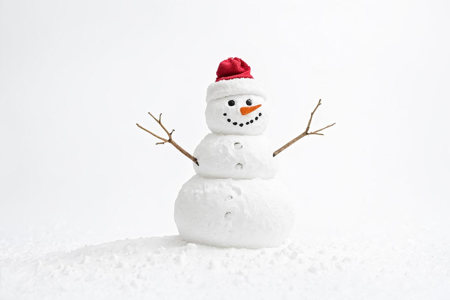 Snowman with a red Santa hat photo