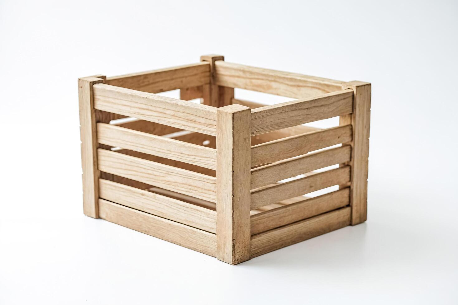 Empty wooden crate on white background photo