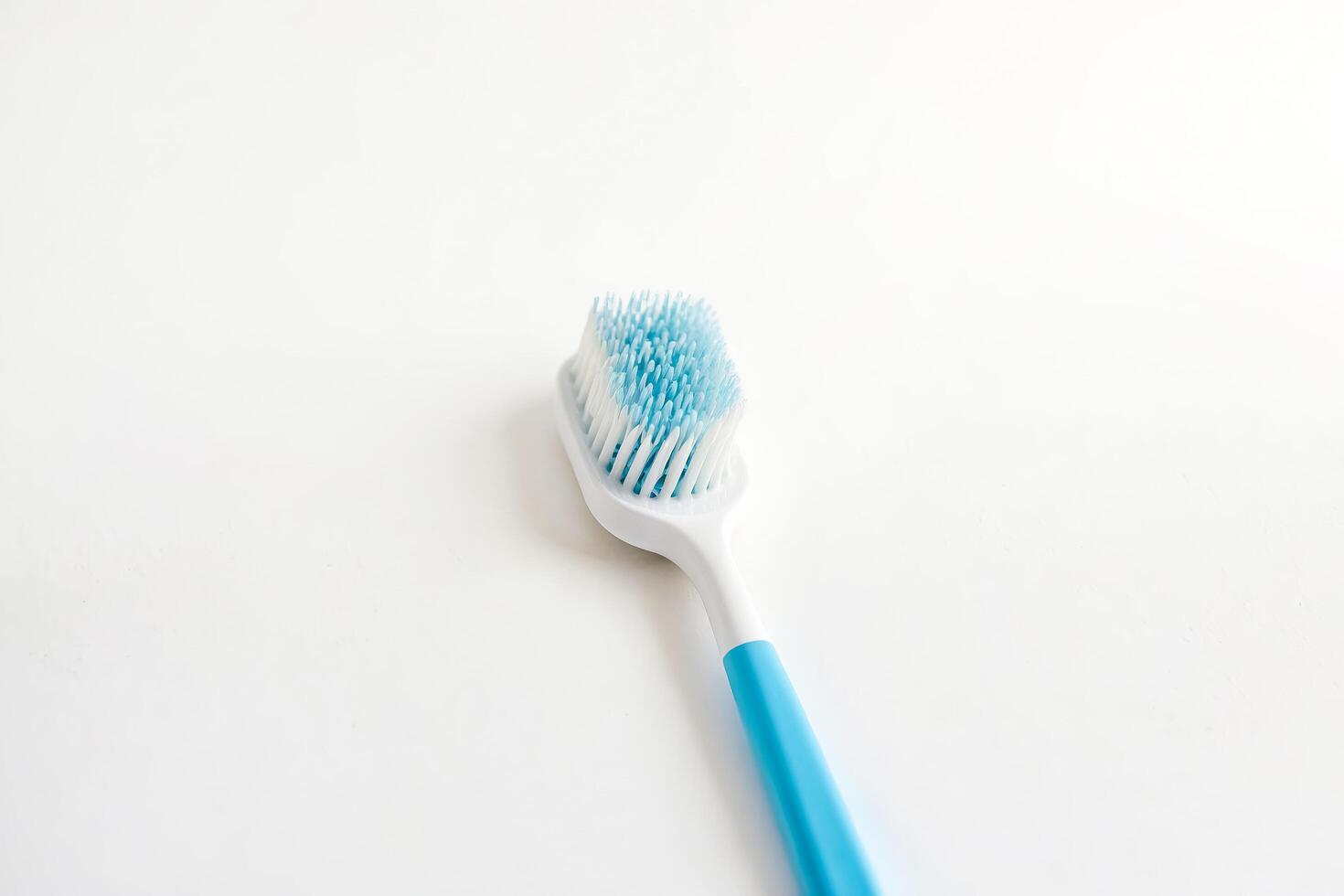 Blue Toothbrush on White Background photo