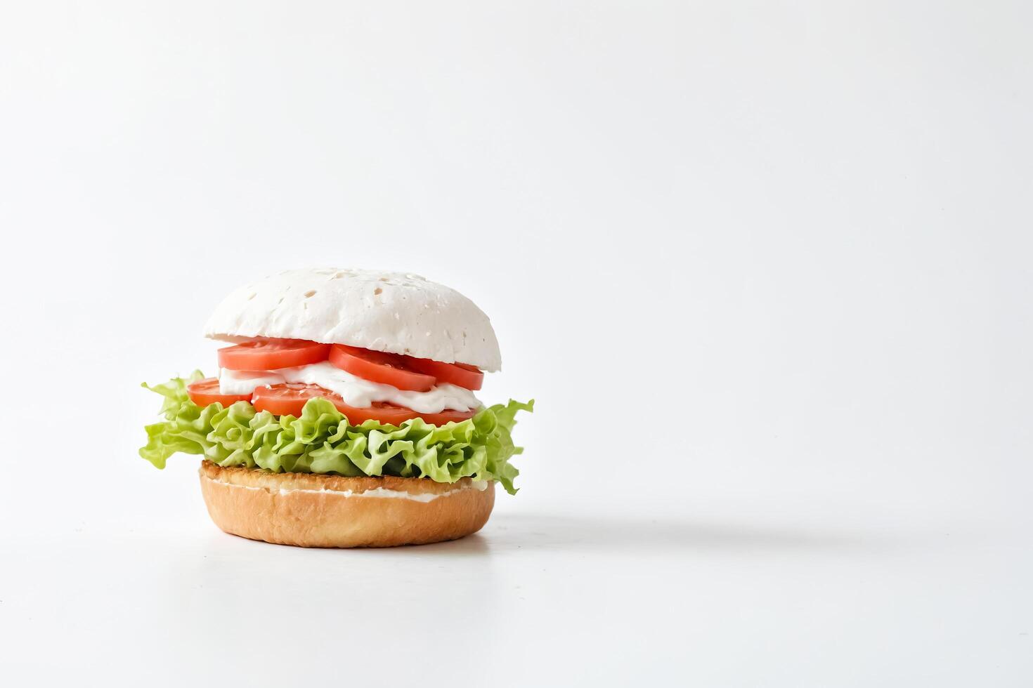 Vegetarian Burger with Lettuce and Tomatoes photo