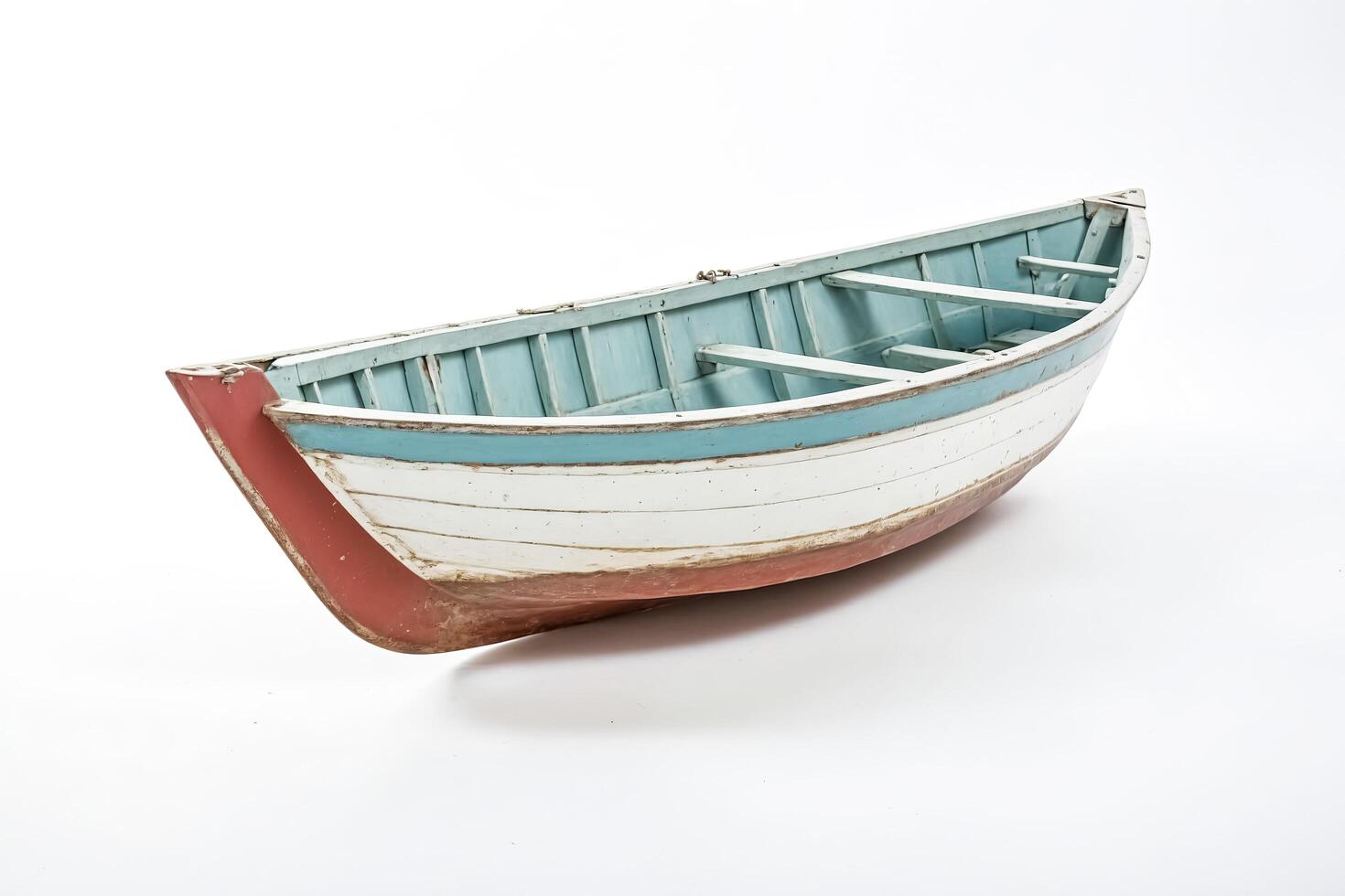 Vintage Wooden Rowboat Isolated on White Background photo