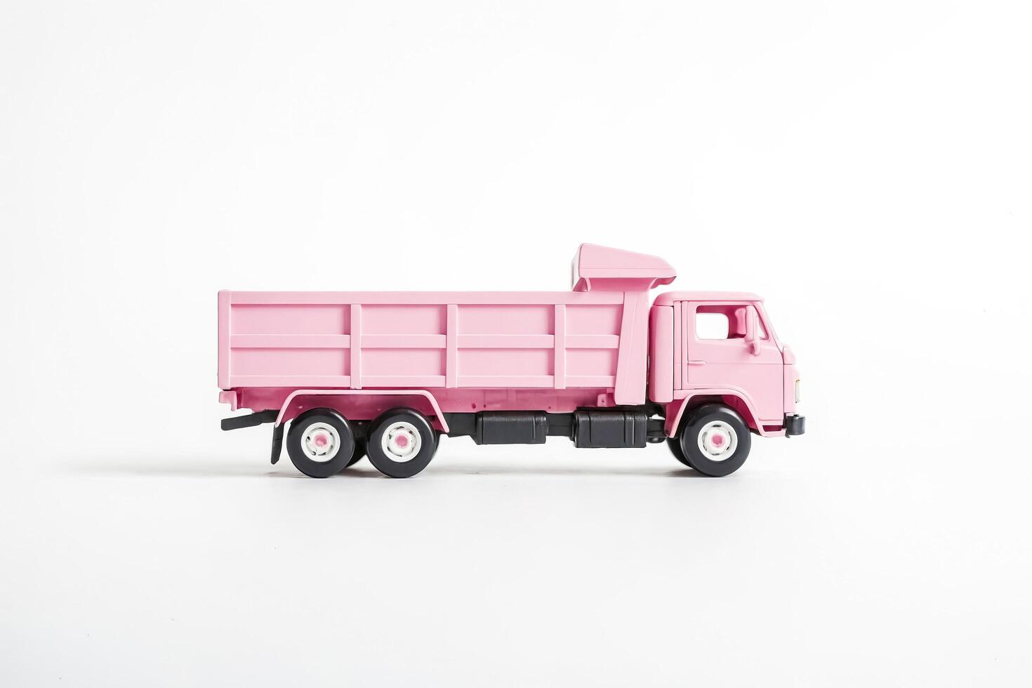 Pink Toy Dump Truck on White Background photo