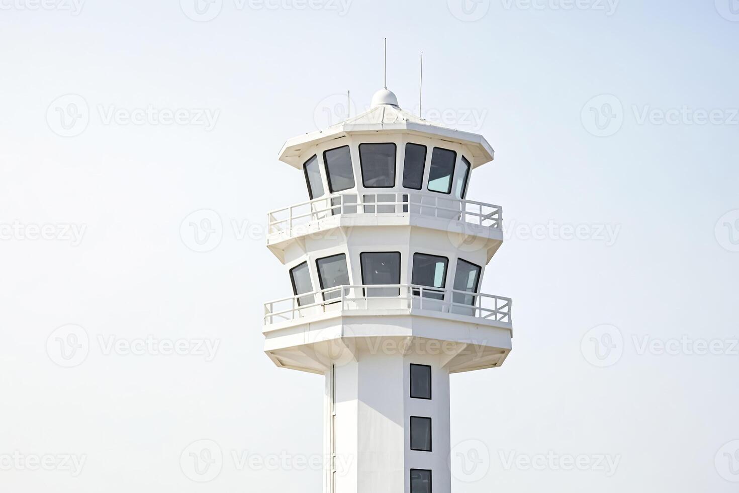 White Control Tower Against Blue Sky photo