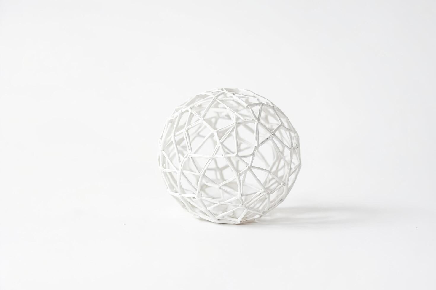 White geometric sphere on a white background photo