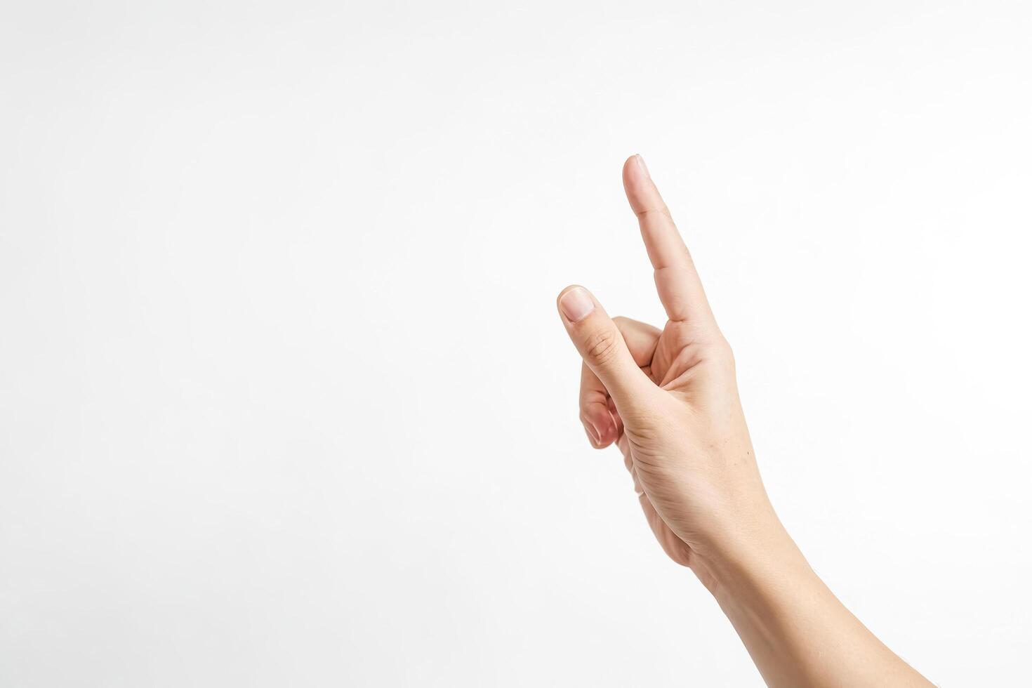 Hand pointing up isolated on white background photo