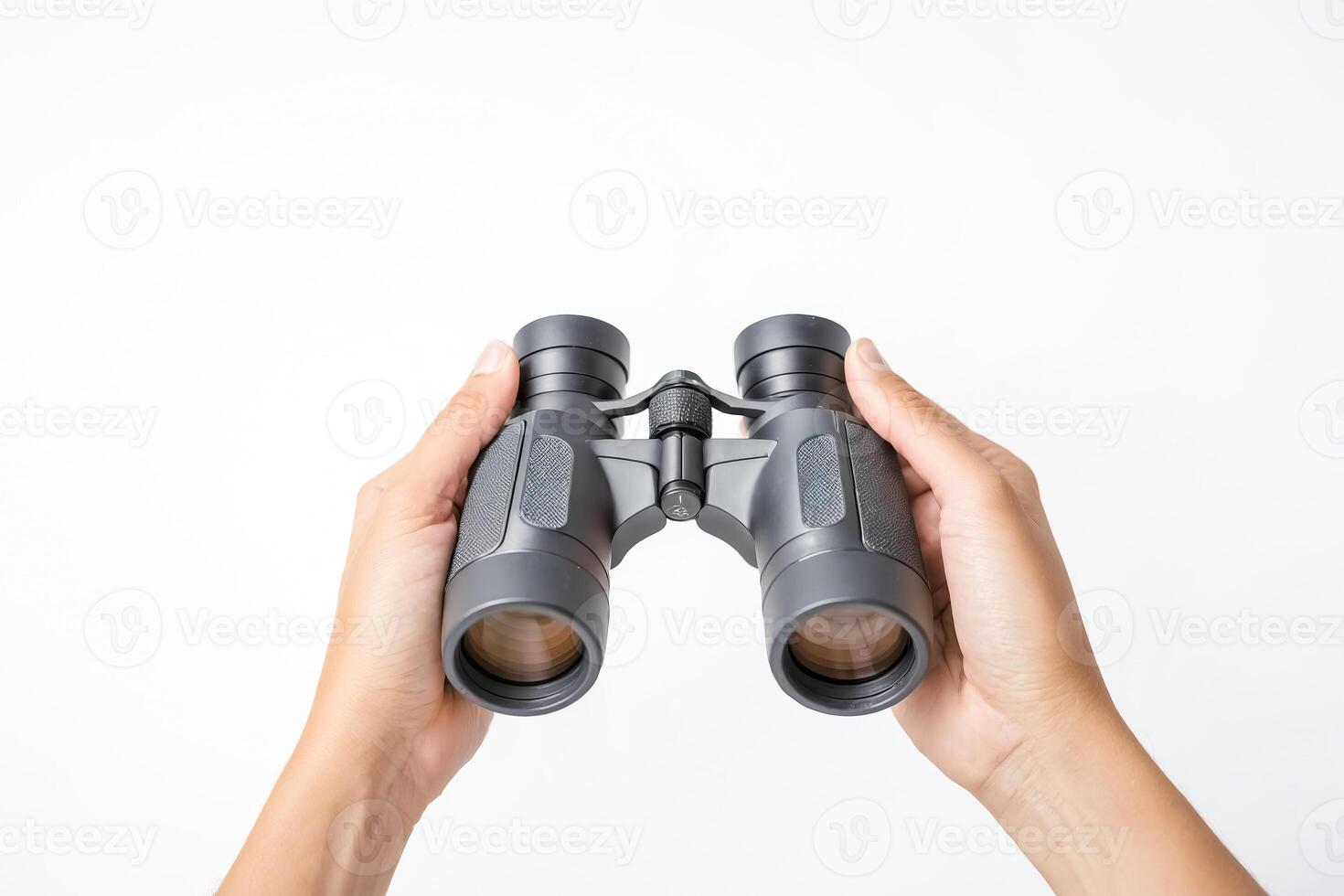 Close-up of Hands Holding Binoculars on a White Background photo