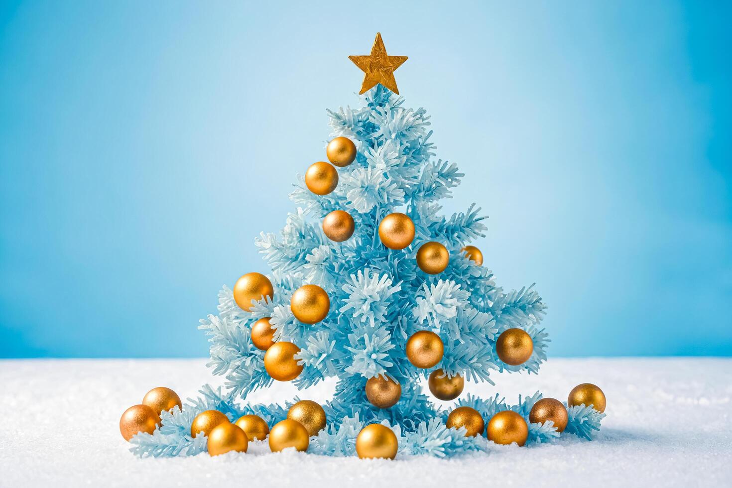 Blue Christmas Tree with Gold Ornaments photo