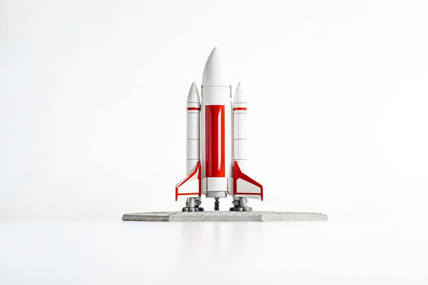 White Rocket Toy Standing on a Concrete Pad photo