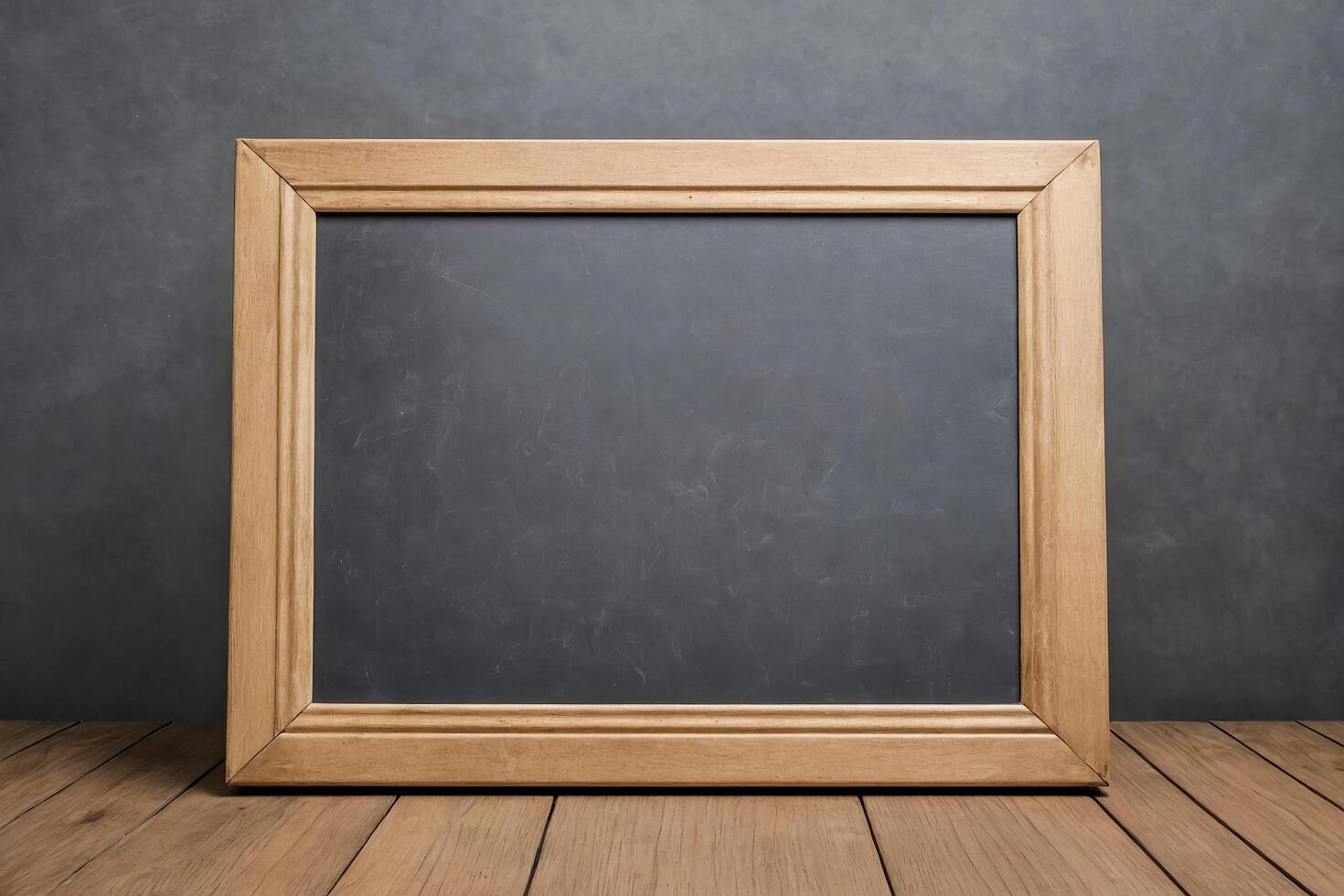 Blank Blackboard in Wooden Frame on Wood Floor photo