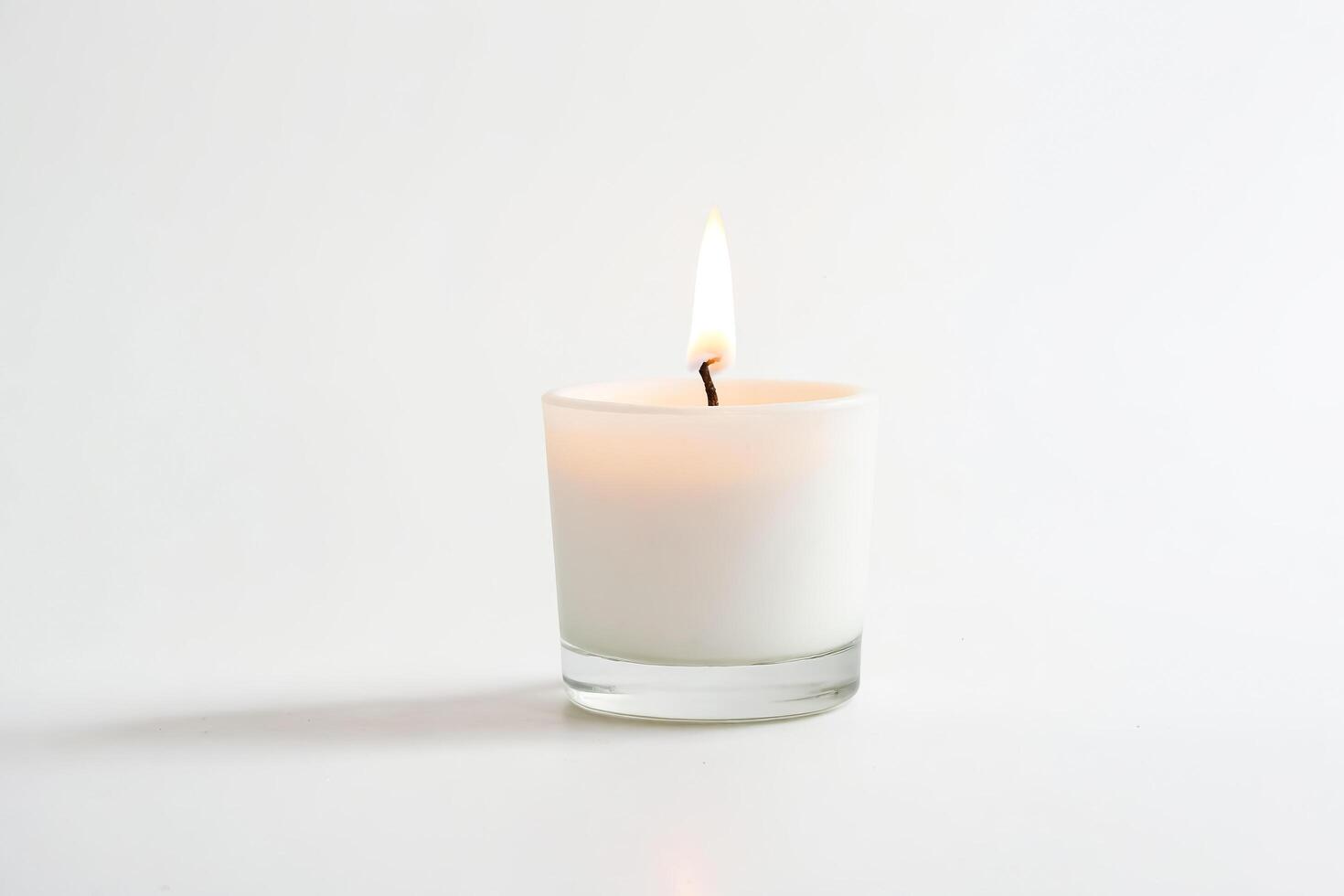 Single White Candle Burning in Glass Jar on White Background 47955305 Single White Candle Burning in Glass Jar on White Background 47955305