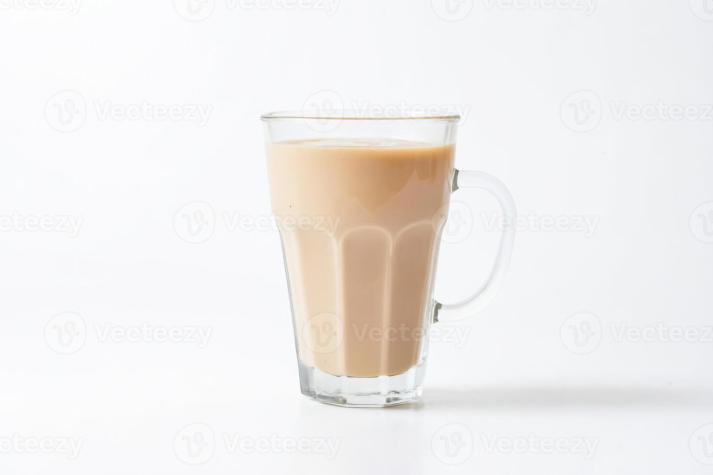 Glass of milk tea on white background photo