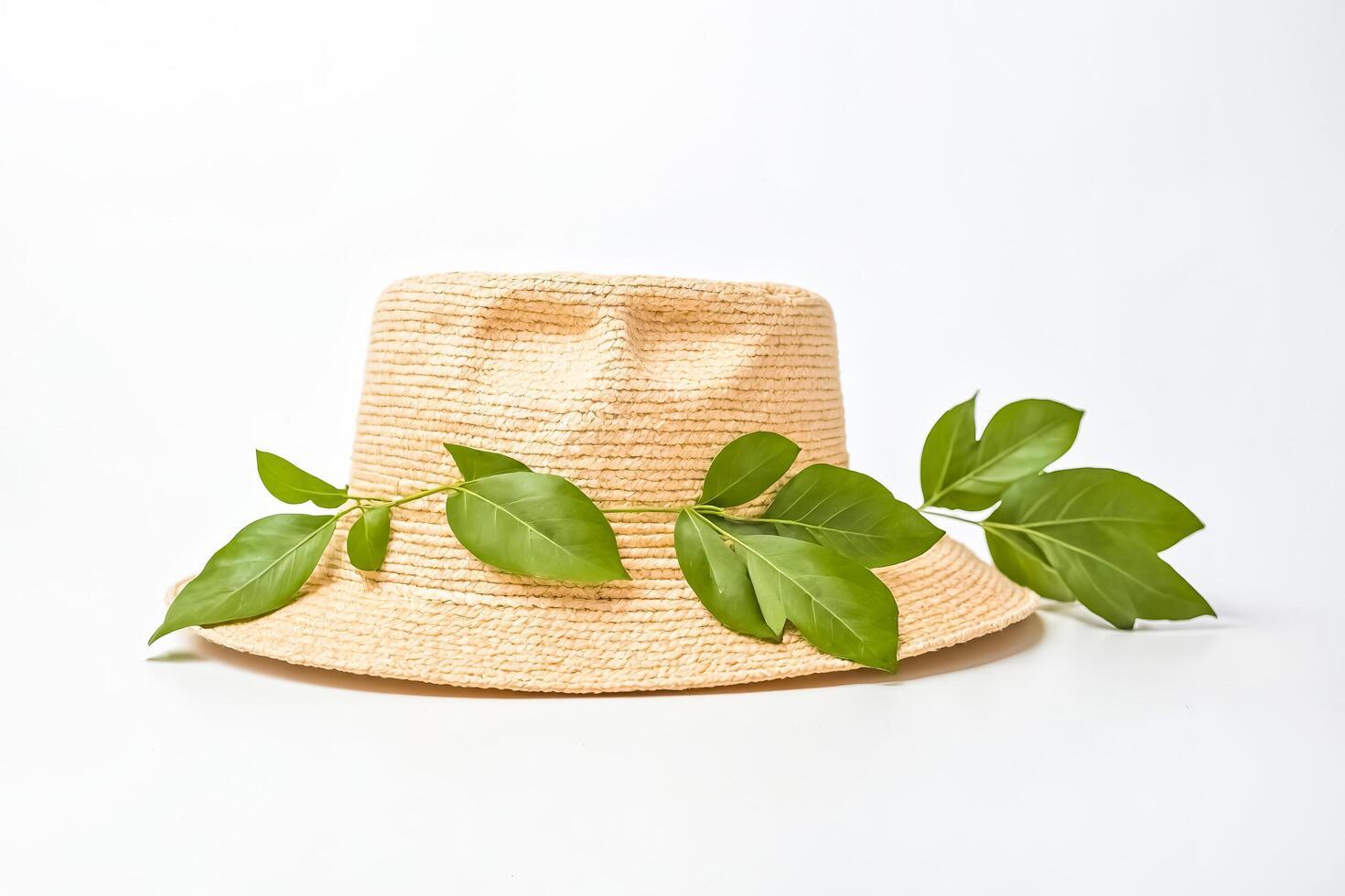 Straw Hat with Green Leaves photo