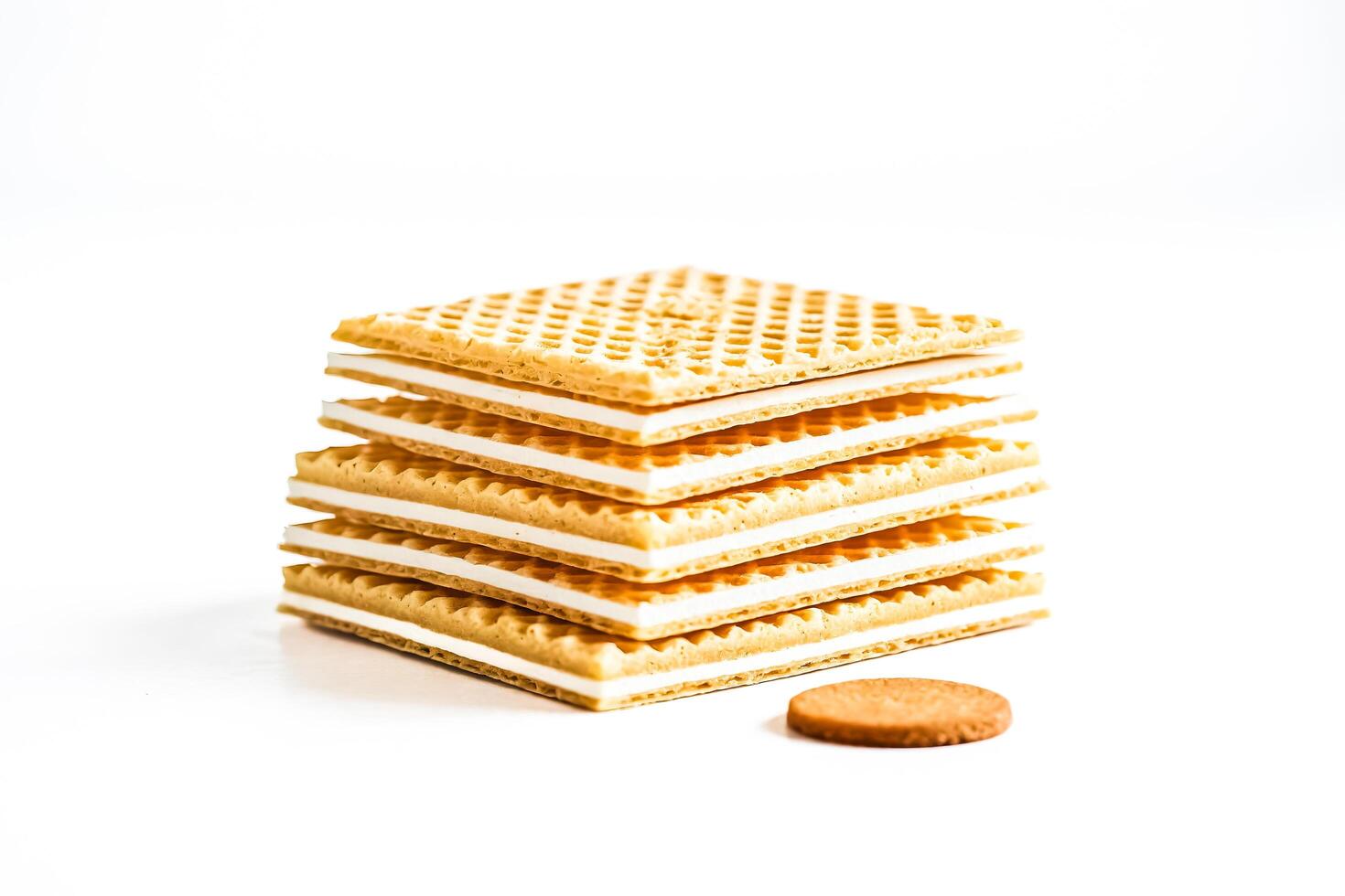 Stack of wafers with white filling isolated on white background photo
