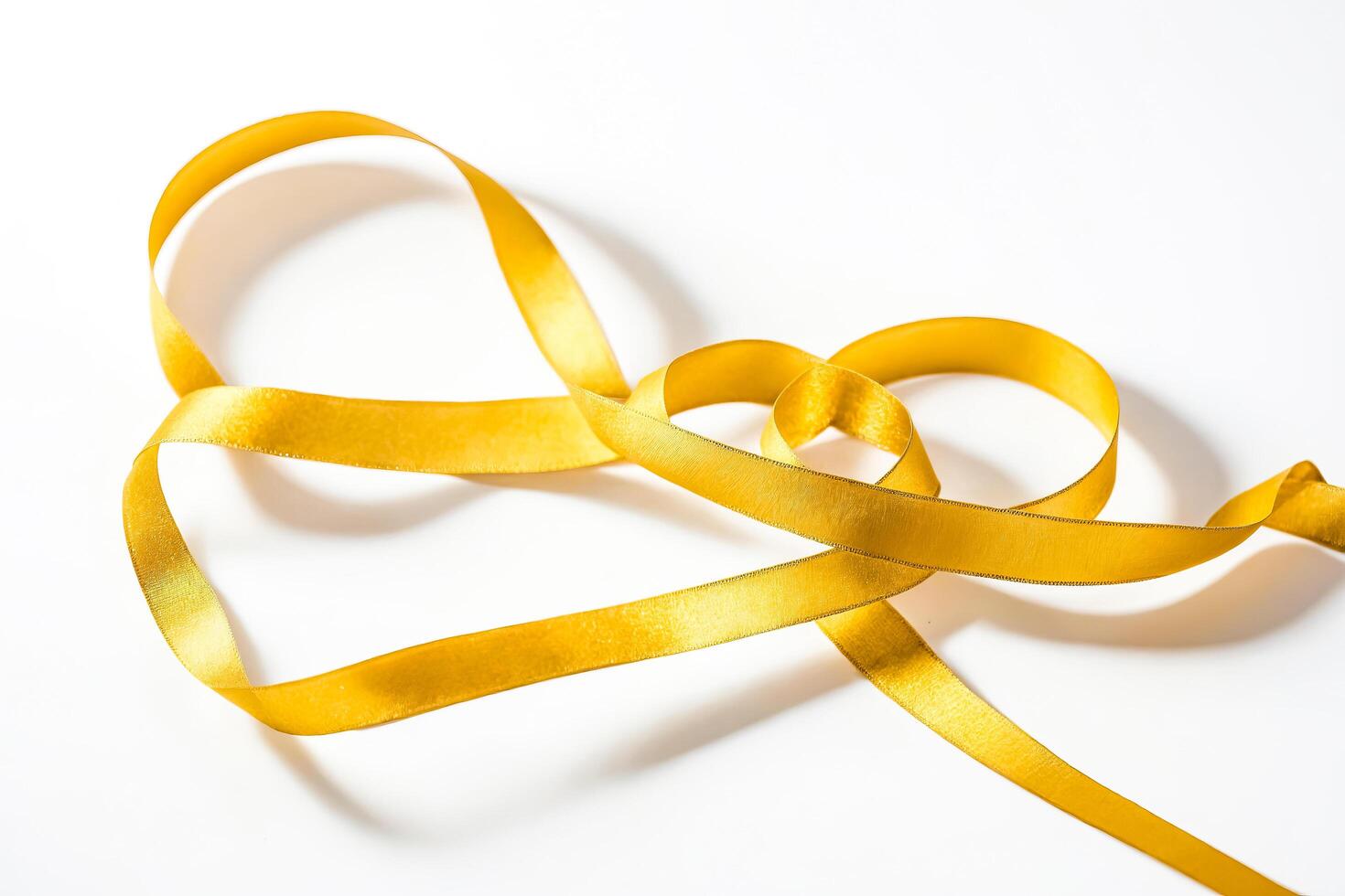 Golden Ribbon on White Background photo