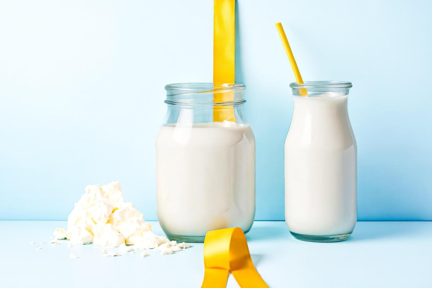 Milk and Cream in Glass Bottles with Yellow Ribbon photo
