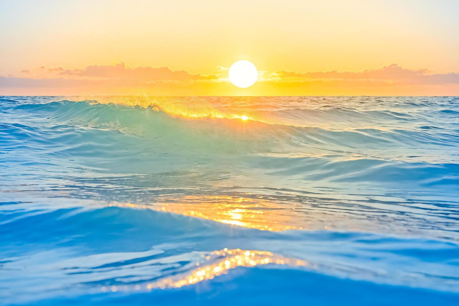 Golden Sunset Reflecting on Ocean Waves photo