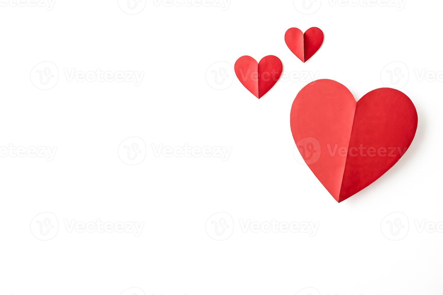 Red Paper Hearts on White Background photo
