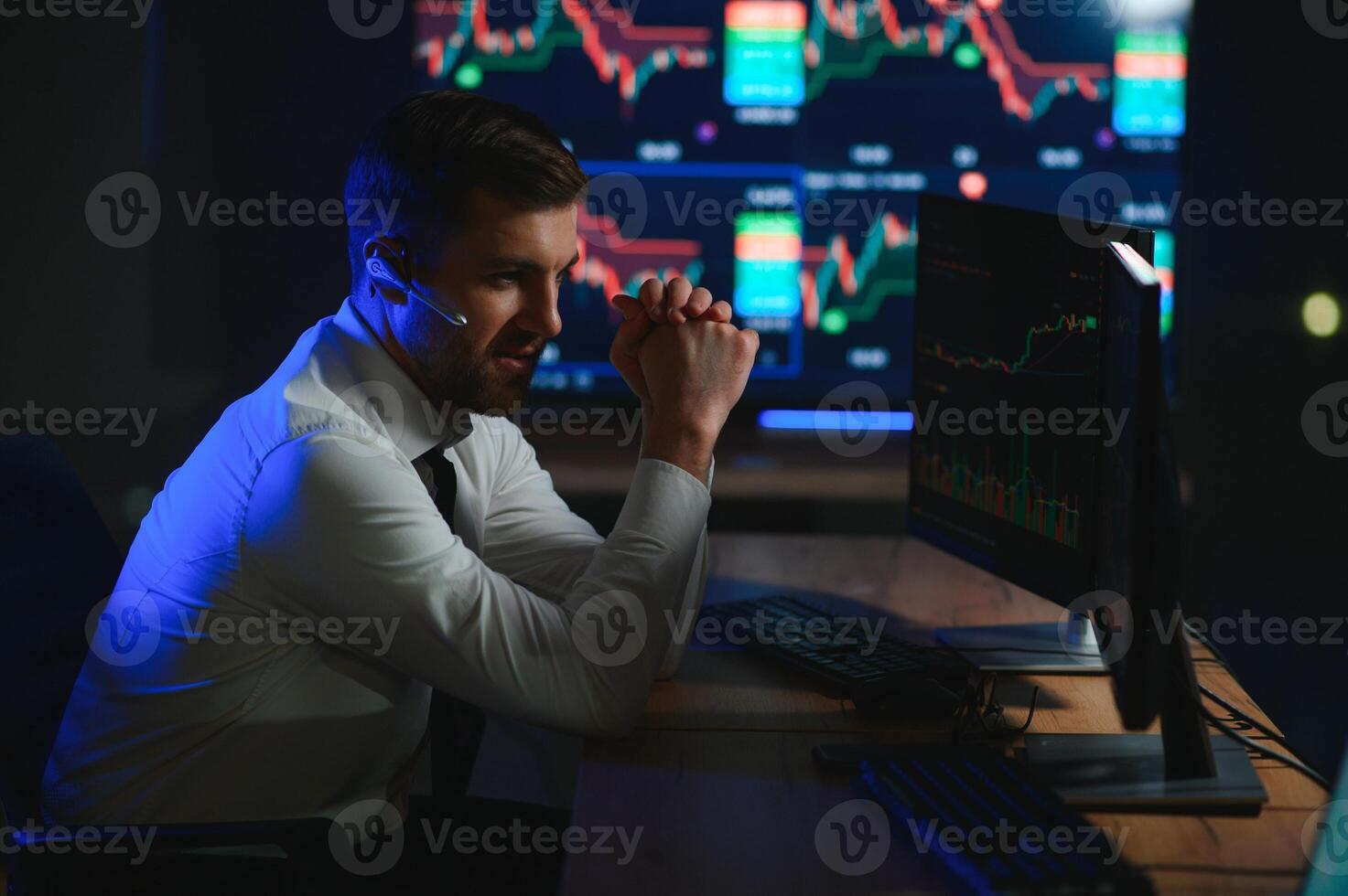 Financial Analysts and Day Traders Working on a Computers with Multi-Monitor photo