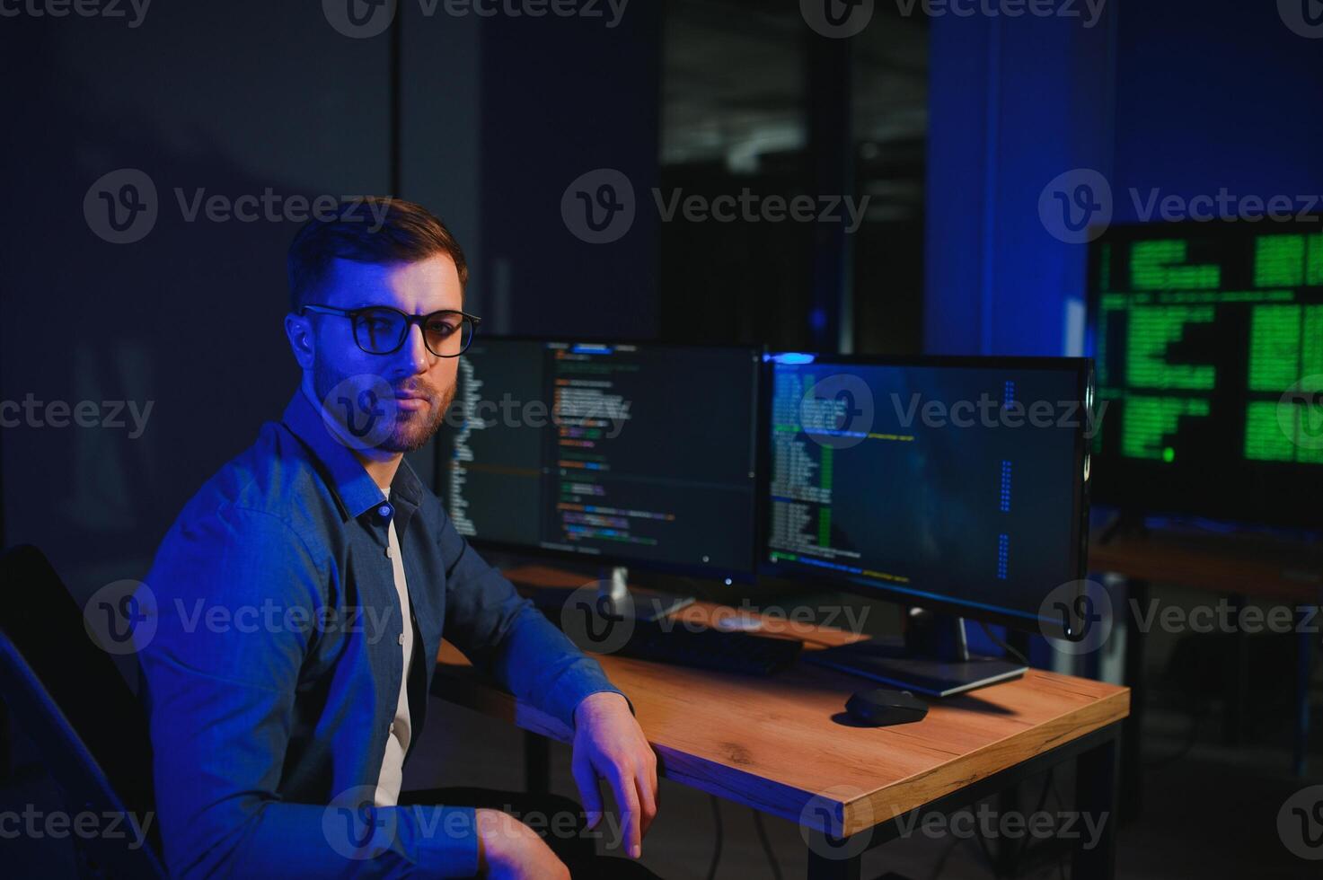 Smart Male IT Programer Working on Desktop photo