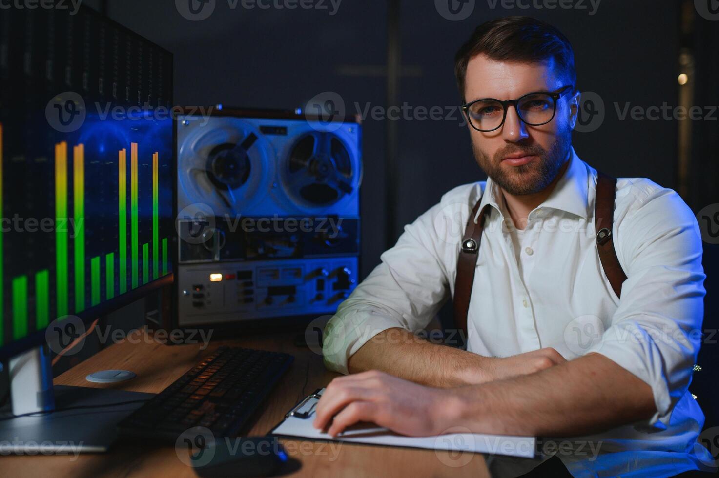 Secret agent listens on the reel tape recorder. Officer wiretapping in headphones. Spying of conversations. Intelligence gathering. Espionage concept photo