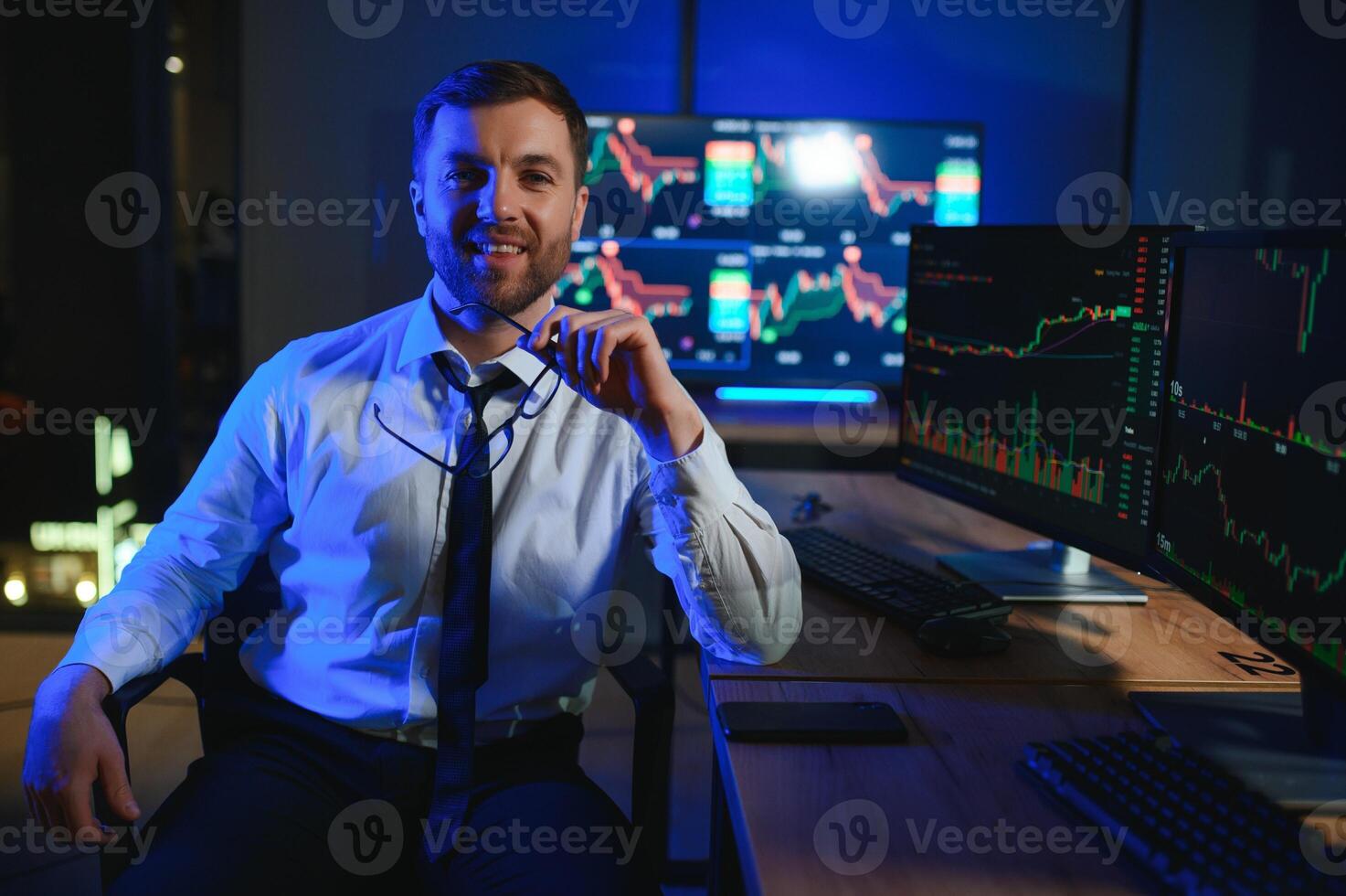 Financial Analysts and Day Traders Working on a Computers with Multi-Monitor photo
