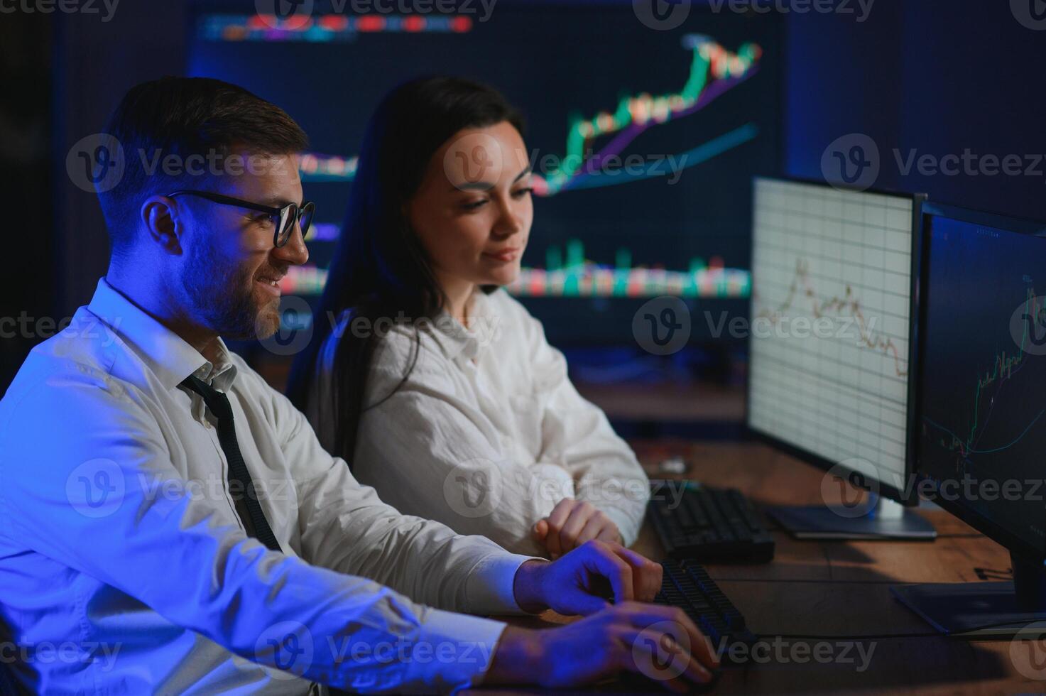 Financial Analyst Talking to Investment Banker in Late Evening at Work photo