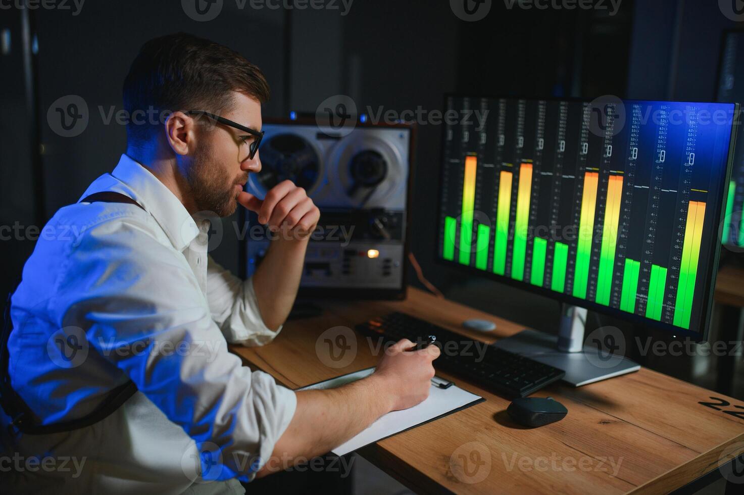 A police officer records a telephone conversation on a tape recorder. secret agent photo
