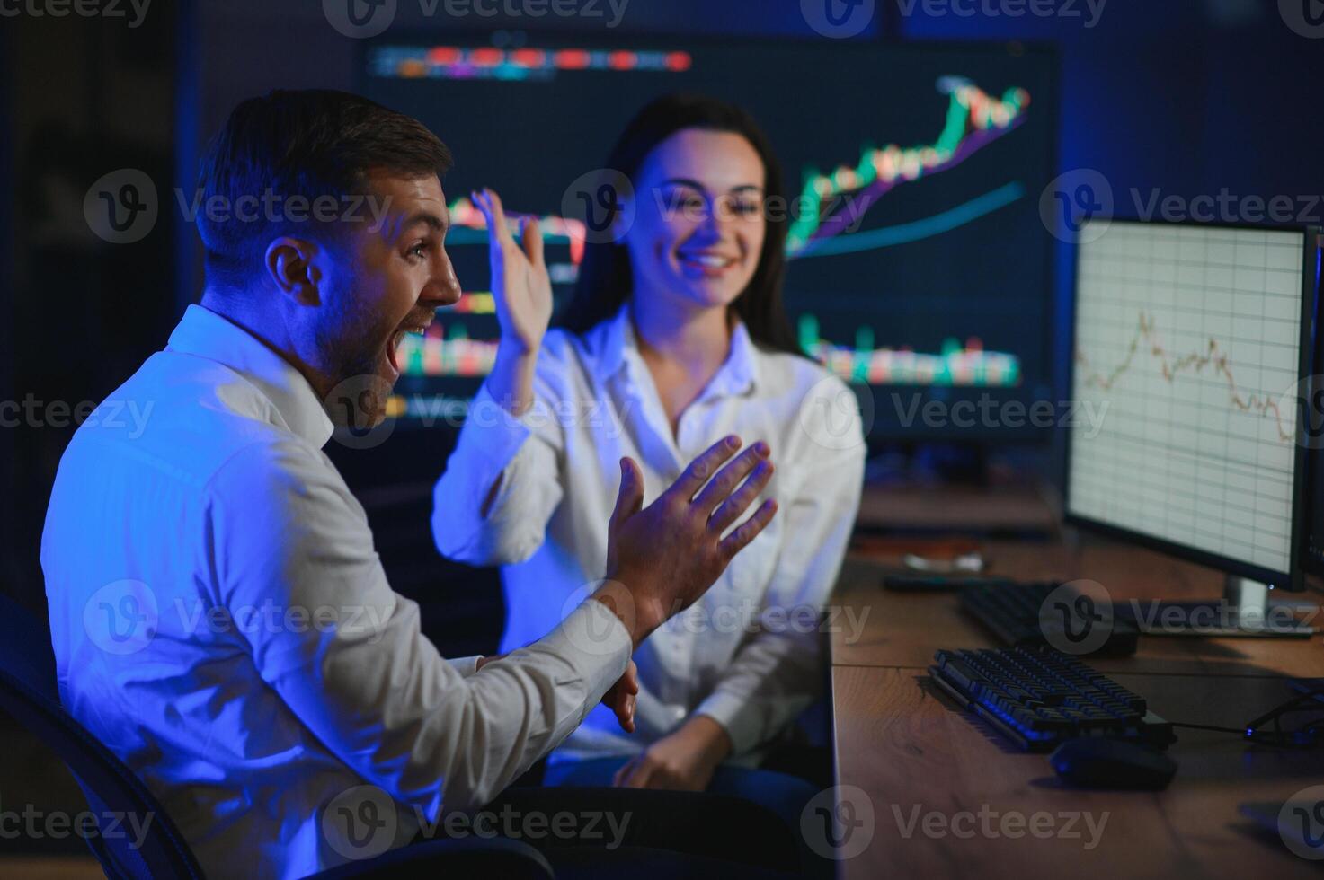 Financial Analyst Talking to Investment Banker in Late Evening at Work photo