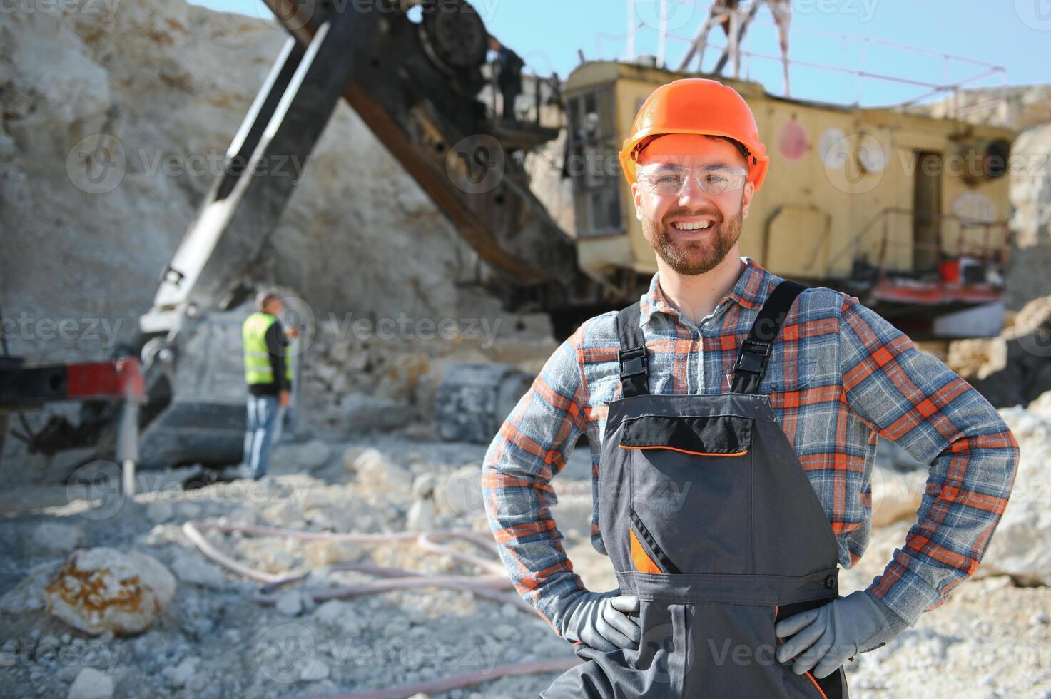 Worker and quarry in background photo