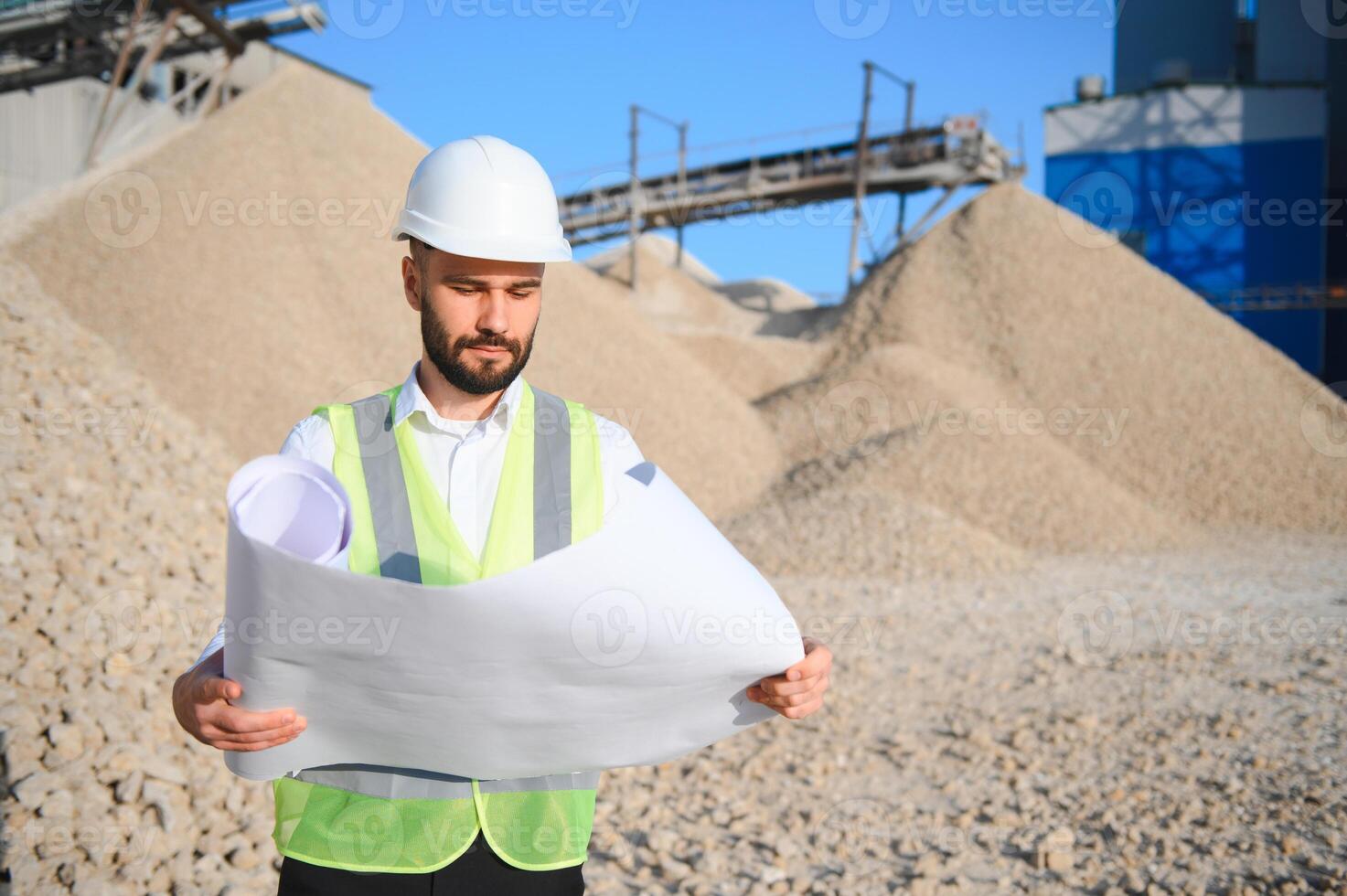 An engineer at a crushed stone or gravel plant. Stone mining photo