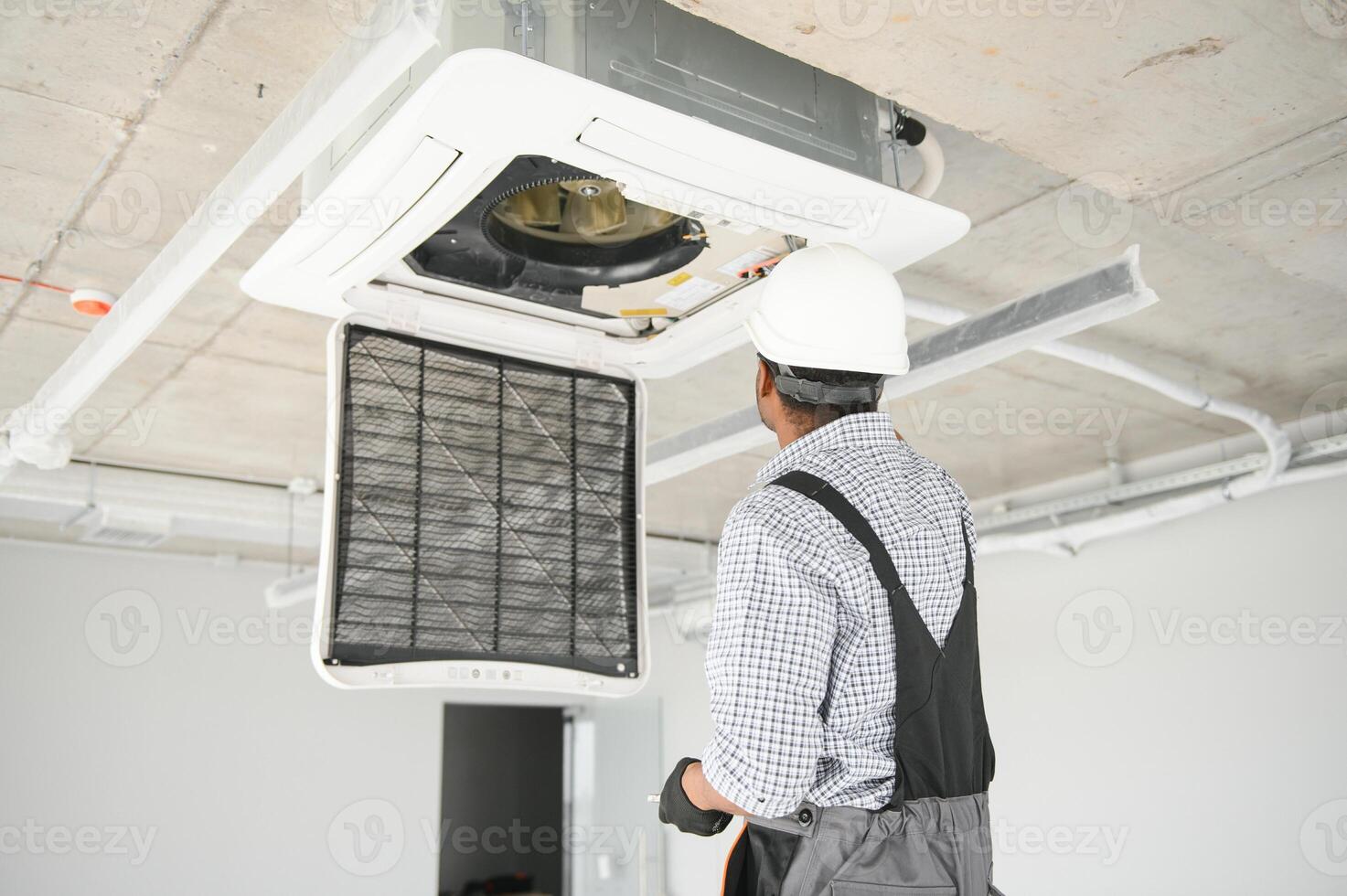 AC Electrician Technician Repairing Air Conditioner Appliance photo