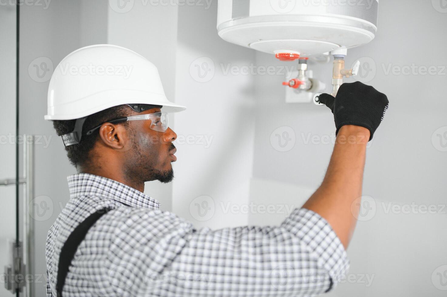 African american worker set up gas heating boiler at home photo